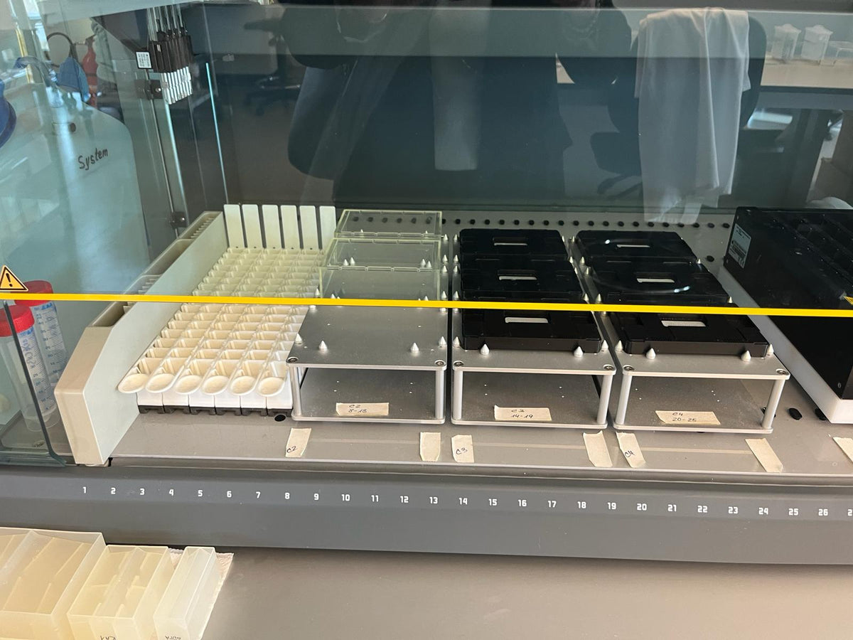 Tecan Freedom EVO 150 work area with sample holders in the GenoLine laboratory